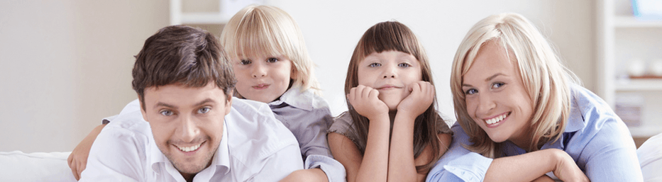 happy family leaning on the couch